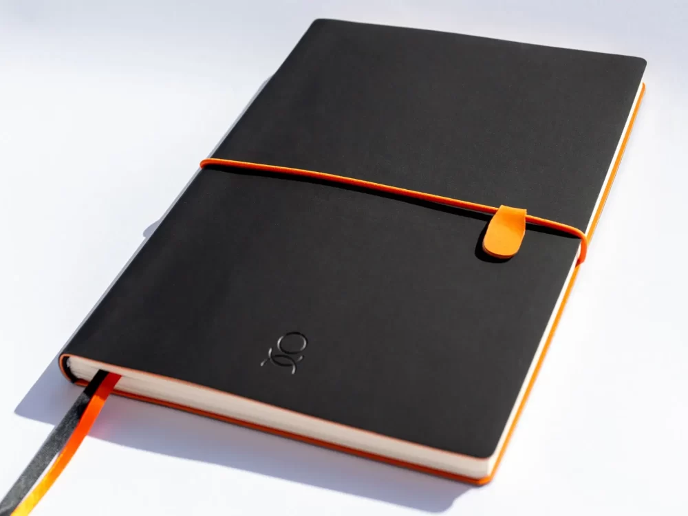 Transitional Journal with elastic strap on table